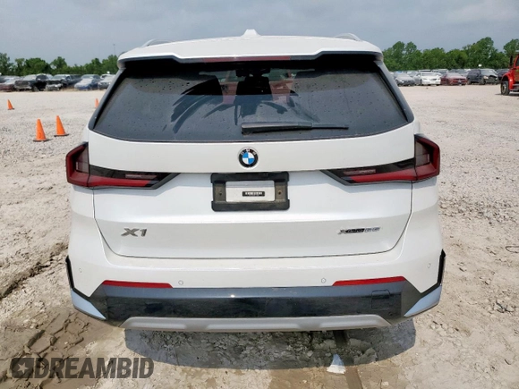 2023 BMW X1 xDrive28i with VIN WBX73EF06P5V77660, listed as a Copart auction lot 57342015 with 32,028 mi miles and Salvage title. Bid and sale history available at DreamBid. Image 6.