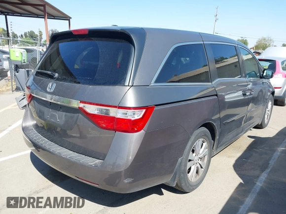 2012 Honda Odyssey EX-L with VIN 5FNRL5H65CB012428, listed as a IAAI auction lot 42164272 with 256,253 mi miles and . Bid and sale history available at carsss.com. Image 4.