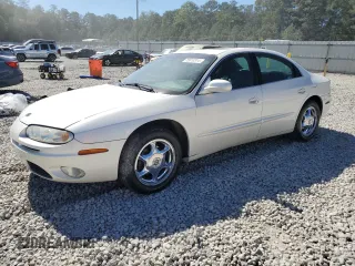 2003 Oldsmobile Aurora z VIN 1G3GS64CX34163493, wystawiony jako Copart lot #75863314 z przebiegiem 211 607 mil mil oraz Szkody całkowita. Historia ofert i sprzedaży dostępna na DreamBid. Obrazek 1.