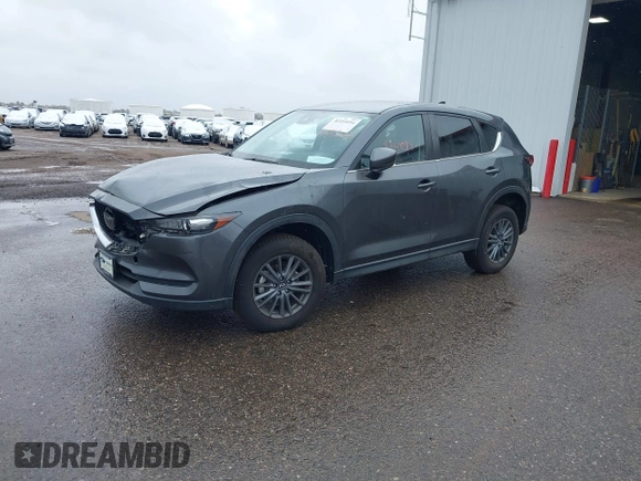 2021 Mazda CX-5 Touring with VIN JM3KFBCM8M0311433, listed as a IAAI auction lot 40554094 with 23,319 mi miles. Bid and sale history available at carsss.com. Image 2.