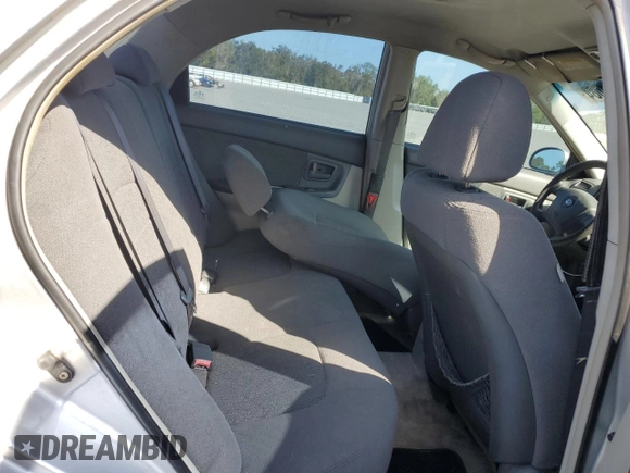 2006 Kia Spectra EX with VIN KNAFE121365229594, listed as a Copart auction lot 77311084 with 129,789 mi miles and Salvage Title. Bid and sale history available at carsss.com. Image 10.