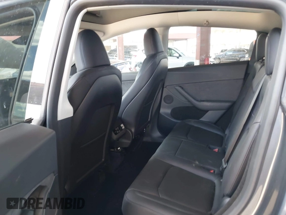 2023 Tesla Model Y Long Range with VIN 7SAYGDEE4PF875915, listed as a IAAI auction lot 42095178 with 11,928 mi miles and . Bid and sale history available at DreamBid. Image 8.