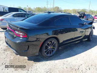 2022 Dodge Charger Scat Pack with VIN 2C3CDXGJ7NH125951, listed as a IAAI auction lot 41811902 with 24,399 mi miles and . Bid and sale history available at carsss.com. Image 4.