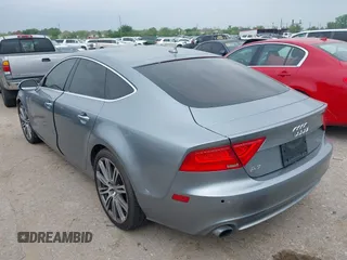 2013 Audi A7 Premium Plus with VIN WAUYGAFC1DN069906, listed as a IAAI auction lot 41906962 with 203,149 mi miles and . Bid and sale history available at DreamBid. Image 3.