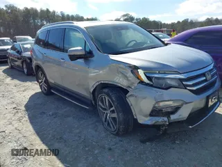 2017 Honda Pilot Touring with VIN 5FNYF6H94HB006873, listed as a IAAI auction lot 41618529 with 154,689 mi miles. Bid and sale history available at carsss.com. Image 1.