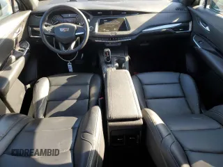 2021 Cadillac XT4 FWD Luxury z VIN 1GYAZAR49MF081955, wystawiony jako Copart lot #76611074 z przebiegiem 34 635 mil mil oraz Szkoda całkowita • Salvage title. Historia ofert i sprzedaży dostępna na DreamBid. Obrazek 8.