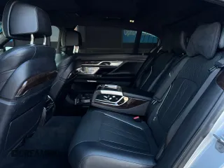 2017 BMW 7 Series 750i с VIN WBA7F0C31HGM21647, выставлен на аукционе Copart как лот 48763345 с пробегом 27 590 миль миль и Чистый • Clean title. История ставок и продаж доступна на DreamBid. Изображение 6.