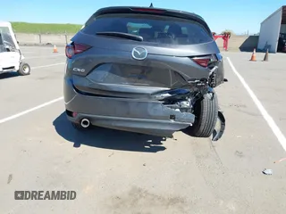 2019 Mazda CX-5 Touring with VIN JM3KFACM1K0533142, listed as a IAAI auction lot 41880181 with Not Provided miles and . Bid and sale history available at carsss.com. Image 16.