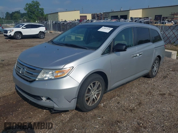 2012 Honda Odyssey EX-L with VIN 5FNRL5H65CB039015, listed as a IAAI auction lot 42612886 with 216,955 mi miles and . Bid and sale history available at DreamBid. Image 2.