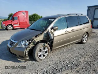 2009 Honda Odyssey Touring with VIN 5FNRL389X9B002453, listed as a Copart auction lot 60649945 with 135,966 mi miles and Salvage title. Bid and sale history available at DreamBid. Image 1.