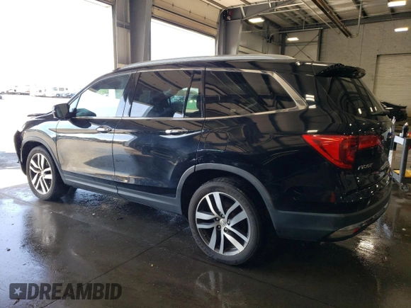 2017 Honda Pilot Touring with VIN 5FNYF6H97HB036935, listed as a Copart auction lot 71757334 with 68,641 mi miles and Salvage Title. Bid and sale history available at DreamBid. Image 2.