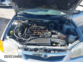 2000 Mazda Protege ES with VIN JM1BJ2213Y0284890, listed as a IAAI auction lot 42088671 with 215,104 mi miles and . Bid and sale history available at DreamBid. Image 10.