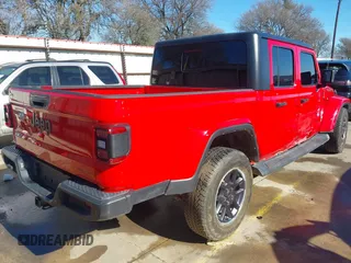 2021 Jeep Gladiator Freedom z VIN 1C6HJTAG7ML609661, wystawiony jako IAAI lot #41410756 z przebiegiem 44 636 mil mil oraz . Historia ofert i sprzedaży dostępna na DreamBid. Obrazek 4.