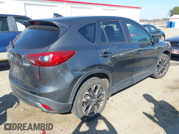 2016 Mazda CX-5 Grand Touring with VIN JM3KE4DY8G0823567, listed as a IAAI auction lot 41784384 with 143,836 mi miles and . Bid and sale history available at carsss.com. Image 4.