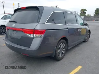 2014 Honda Odyssey Touring with VIN 5FNRL5H97EB114634, listed as a IAAI auction lot 42105220 with Not Provided miles and . Bid and sale history available at carsss.com. Image 4.