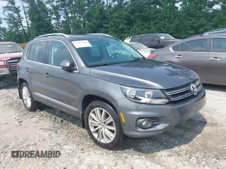 2014 Volkswagen Tiguan SE z VIN WVGAV3AX0EW576108, wystawiony jako IAAI lot #42405804 z przebiegiem 117 530 mil mil oraz . Historia ofert i sprzedaży dostępna na DreamBid. Obrazek 1.
