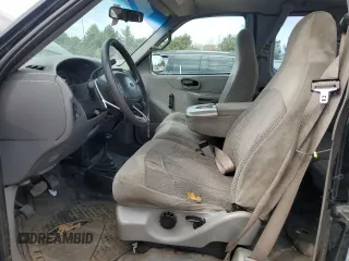 1999 Ford F-150 with VIN 1FTRX18W1XKC00918, listed as a Copart auction lot 53830305 with 205,205 mi miles and Salvage title. Bid and sale history available at DreamBid. Image 7.