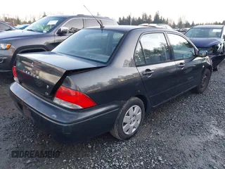 2003 Mitsubishi Lancer ES with VIN JA3AJ26E83U006060, listed as a IAAI auction lot 41254660 with 220,490 mi miles. Bid and sale history available at carsss.com. Image 4.