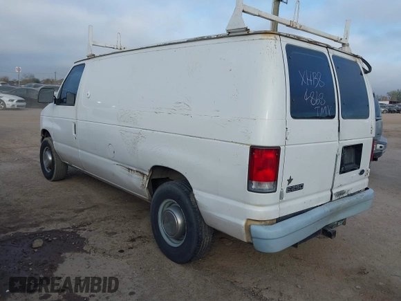 1999 Ford Econoline Cargo Commercial with VIN 1FTNE24L3XHB84868, listed as a IAAI auction lot 41151145 with 450,651 mi miles and . Bid and sale history available at carsss.com. Image 3.