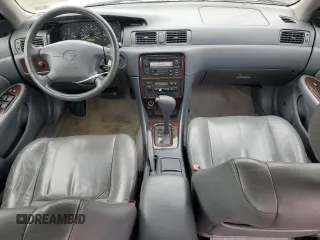 2000 Toyota Camry CE z VIN JT2BG28KXY0432024, wystawiony jako Copart lot #57057905 z przebiegiem 201 289 mil mil oraz Szkoda całkowita • Salvage title. Historia ofert i sprzedaży dostępna na DreamBid. Obrazek 8.