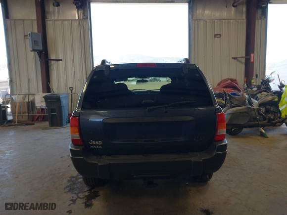 2003 Jeep Grand Cherokee Laredo with VIN 1J4GW48S33C539977, listed as a IAAI auction lot 42027703 with 100,534 mi miles. Bid and sale history available at carsss.com. Image 17.