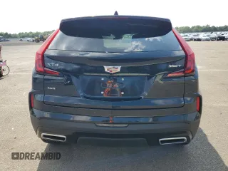 2024 Cadillac XT4 AWD Premium Luxury with VIN 1GYFZDR49RF112460, listed as a Copart auction lot 67183524 with 12,396 mi miles and Salvage title. Bid and sale history available at DreamBid. Image 6.