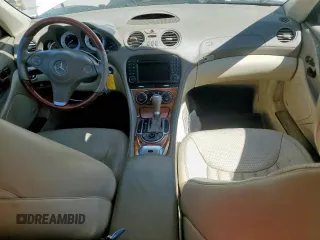2009 Mercedes-Benz SL 550 with VIN WDBSK71F69F147589, listed as a Copart auction lot 65976995 with 77,387 mi miles and Salvage title. Bid and sale history available at DreamBid. Image 8.