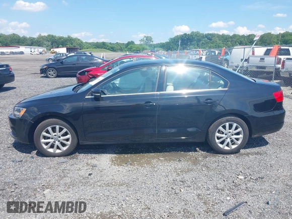 2014 Volkswagen Jetta SE with VIN 3VWD17AJ4EM429576, listed as a IAAI auction lot 42542604 with 142,313 mi miles and . Bid and sale history available at DreamBid. Image 14.