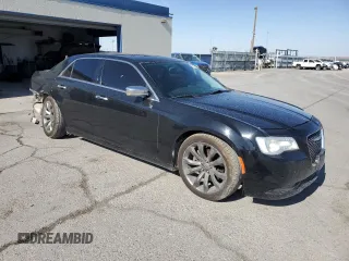 2015 Chrysler 300 C with VIN 2C3CCAET4FH772748, listed as a Copart auction lot 61331724 with 97,856 mi miles and Salvage Title. Bid and sale history available at DreamBid. Image 4.