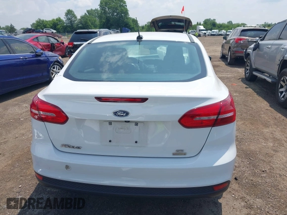 2018 Ford Focus SE z VIN 1FADP3FE5JL267982, wystawiony jako IAAI lot #42646881 z przebiegiem 40 163 mil mil oraz . Historia ofert i sprzedaży dostępna na DreamBid. Obrazek 16.