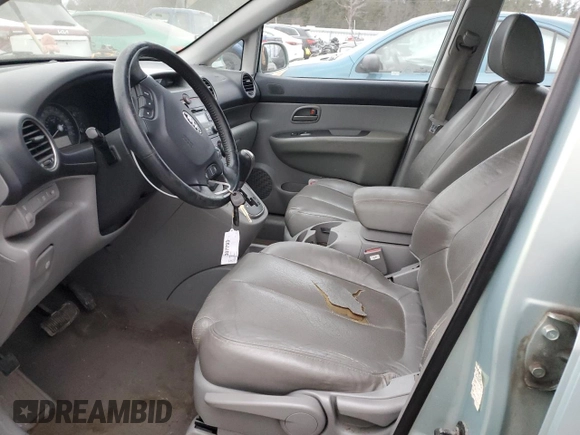 2007 Kia Rondo LX Base with VIN KNAFG525X77093670, listed as a Copart auction lot 87956025 with 138,330 mi miles and Salvage Title. Bid and sale history available at carsss.com. Image 7.