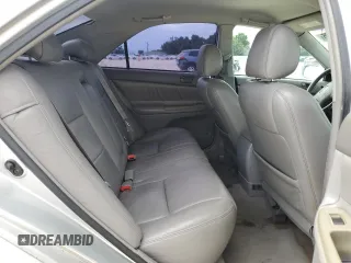 2002 Toyota Camry XLE z VIN 4T1BF32K12U519069, wystawiony jako Copart lot #55501405 z przebiegiem 186 142 mil mil oraz Szkoda całkowita • Salvage title. Historia ofert i sprzedaży dostępna na DreamBid. Obrazek 10.