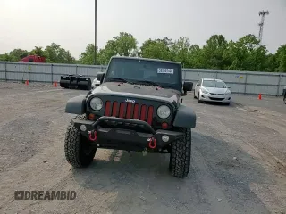 2013 Jeep Wrangler Sport z VIN 1C4AJWAG5DL671491, wystawiony jako Copart lot #59306745 z przebiegiem 111 778 mil mil oraz Szkoda całkowita • Salvage title. Historia ofert i sprzedaży dostępna na DreamBid. Obrazek 13.