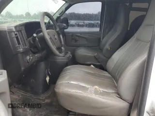 2014 Chevrolet Express Passenger 1LS with VIN 1GAZGZFAXE1105162, listed as a Copart auction lot 72773154 with 97,950 mi miles and Salvage title. Bid and sale history available at DreamBid. Image 7.