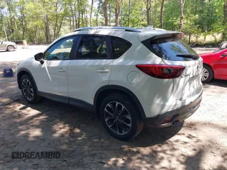 2016 Mazda CX-5 Grand Touring with VIN JM3KE2DY0G0870077, listed as a IAAI auction lot 42158225 with 93,816 mi miles. Bid and sale history available at carsss.com. Image 3.