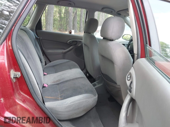 2003 Ford Focus SE Fleet z VIN 1FAFP36333W157750, wystawiony jako IAAI lot #42418479 z przebiegiem 73 273 mil mil oraz . Historia ofert i sprzedaży dostępna na DreamBid. Obrazek 8.