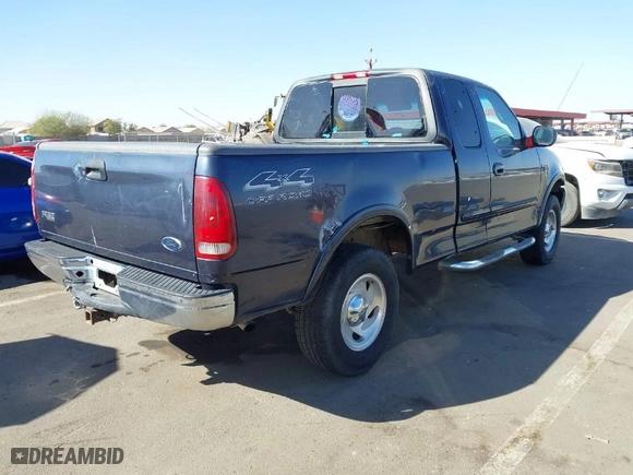 2000 Ford F-150 XL with VIN 1FTRX18L2YKA10388, listed as a IAAI auction lot 41526430 with 144,480 mi miles. Bid and sale history available at carsss.com. Image 4.