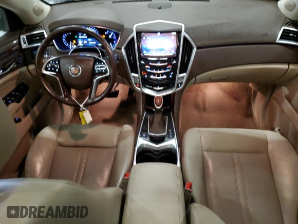 2014 Cadillac SRX Premium Collection z VIN 3GYFNGE36ES581361, wystawiony jako Copart lot #88540815 z przebiegiem 137 047 mil mil oraz Nie do naprawy. Historia ofert i sprzedaży dostępna na DreamBid. Obrazek 8.