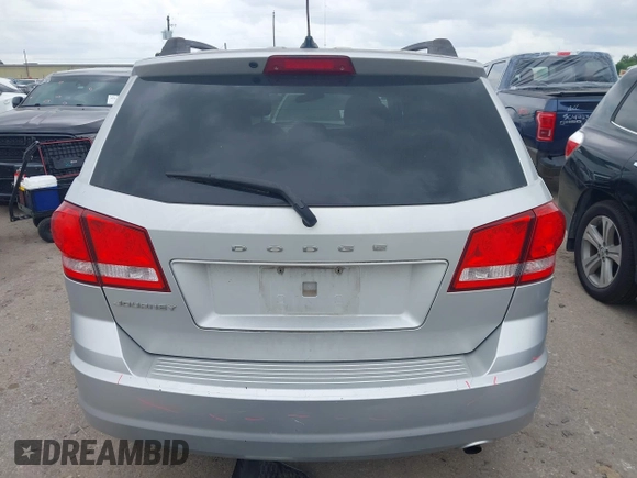 2013 Dodge Journey SE z VIN 3C4PDCAB9DT529668, wystawiony jako IAAI lot #42130654 z przebiegiem 156 472 mil mil oraz . Historia ofert i sprzedaży dostępna na DreamBid. Obrazek 17.