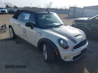 2014 MINI Convertible S with VIN WMWZP3C59ET707323, listed as a IAAI auction lot 41215805 with 129,097 mi miles and . Bid and sale history available at DreamBid. Image 1.