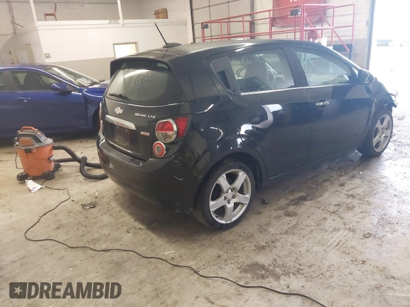 2016 Chevrolet Sonic LTZ z VIN 1G1JE6SB3G4150803, wystawiony jako IAAI lot #42007951 z przebiegiem 124 811 mil mil oraz . Historia ofert i sprzedaży dostępna na DreamBid. Obrazek 4.