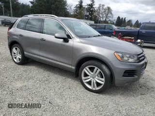 2012 Volkswagen Touareg Sport with VIN WVGFK9BP4CD001860, listed as a Copart auction lot 55090375 with 153,456 mi miles and Salvage title. Bid and sale history available at DreamBid. Image 4.