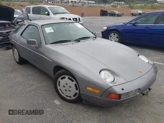 1988 Porsche 928 z VIN WP0JB0928JS860494, wystawiony jako IAAI lot #42195169 z przebiegiem 77 844 mil mil oraz . Historia ofert i sprzedaży dostępna na DreamBid. Obrazek 1.