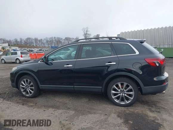 2015 Mazda CX-9 Grand Touring z VIN JM3TB3DV6F0464926, wystawiony jako IAAI lot #42035670 z przebiegiem 168 257 mil mil oraz . Historia ofert i sprzedaży dostępna na DreamBid. Obrazek 14.