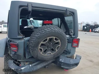 2015 Jeep Wrangler Unlimited Rubicon Hard Rock with VIN 1C4HJWFG1FL679873, listed as a IAAI auction lot 41508722 with 97,165 mi miles. Bid and sale history available at carsss.com. Image 6.