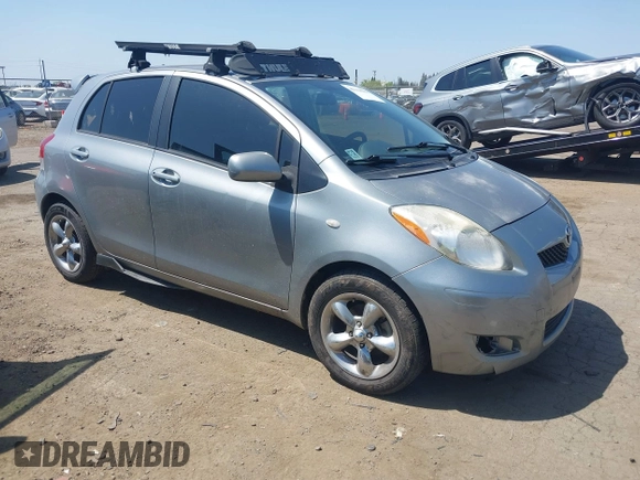 2009 Toyota Yaris with VIN JTDKT903195235991, listed as a IAAI auction lot 42164989 with 249,389 mi miles. Bid and sale history available at carsss.com. Image 1.