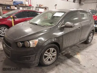 2015 Chevrolet Sonic LT with VIN 1G1JC6SGXF4205148, listed as a IAAI auction lot 41591559 with 144,048 mi miles. Bid and sale history available at carsss.com. Image 2.
