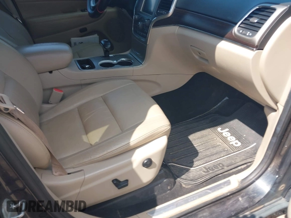 2014 Jeep Grand Cherokee Limited with VIN 1C4RJEBT6EC187548, listed as a IAAI auction lot 42210601 with 138,451 mi miles and . Bid and sale history available at DreamBid. Image 5.