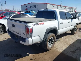 2023 Toyota Tacoma 4WD SR with VIN 3TMCZ5AN7PM653250, listed as a IAAI auction lot 41673534 with 19,496 mi miles. Bid and sale history available at carsss.com. Image 4.