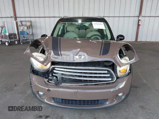 2012 MINI Countryman with VIN WMWZB3C51CWM04563, listed as a IAAI auction lot 42564564 with 95,760 mi miles and . Bid and sale history available at DreamBid. Image 6.